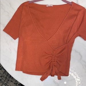 Medium shirt, rusty orange color